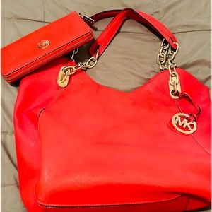 Used MK red tote with gold straps and matching wallet